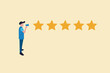 © Aan - businessman with Megaphone and five gold star rating. concept of Customer review, Feedback concept, reputation review.