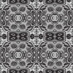 Wall Mural - Abstract seamless pattern of stylized geometric motifs in black and white colors