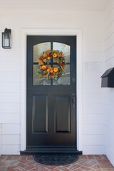 Wall Mural - modern farmhouse with black dutch door and Autumn wreath