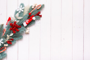 Wall Mural - Christmas composition made from pine tree, snowflakes and festive decorations top view. Xmas flat lay. Copy space