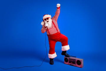 Poster - Full length body size view of his he handsome bearded fat overweight cheerful Santa vocalist star singing hit having fun rest leisure isolated bright vivid shine vibrant red color background