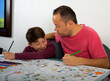 © JUAN CARLOS TINJACA - Dad teaches his son how to paint.