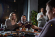 © Daniel - Group of Happy friends having dinner in the restaurant