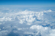 © CsaboPhoto - Clouds from above with blue background.