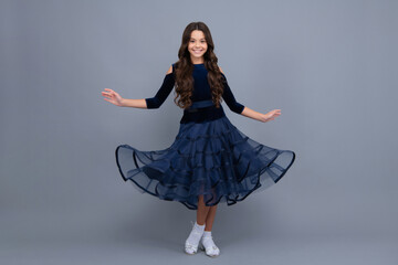 Poster - Happy girl face, positive and smiling emotions. Movement dress of young child teen girl. Full length of teenager child wearing ball dress.