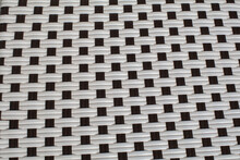 Abstract Black And White Wicker Rattan Knit Chair. Texture Background Extreme Closeup.