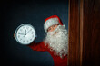 portrait of a boy in a santa costume with a clock