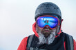 © almostfuture - bearded skier in a frozen helmet and mask fending off a team of freeriders