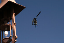  Police Helicopter Flies. Along A Blue Sky