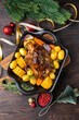  festive food with Christmas New Year Pork shank knuckle with baked potatoes and corn