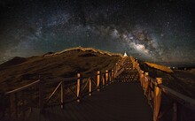 Milky Way Over The Wooden Footbridge In Tibet, China
