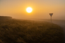 Roadsign On A Moorland Road On A Foggy Winter Morning