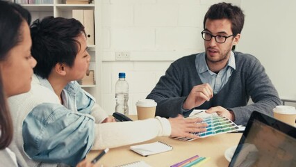 Wall Mural - Interior design, discussion and business people with color palette in office meeting talking, speaking and planning. Teamwork, collaboration and man and women working on design for architect project