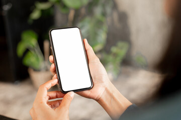 Wall Mural - cell phone blank white screen mockup.hand holding texting using mobile on desk at office.background empty space for advertise.work people contact marketing business,technology