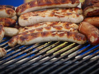 Poster - Closeup shot of sausages on a grill outdoors