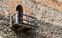 Balcony In The Stone Wall Of An Ancient Castle. 14th Century Building. Copy Space For Text
