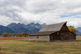 Fototapeta Góry - Grand teton. Wyoming. USA. 10- 03-2022. Old traditional wooden farm near Grand Teton national Park.
