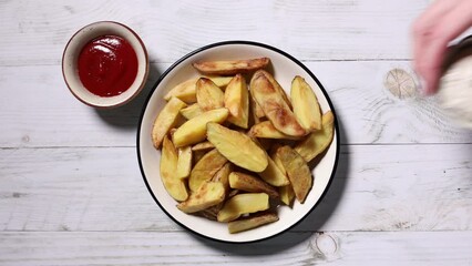 Poster - Plate with baked potatoes wedges top view