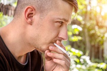 Canvas Print - Young Man is smoking