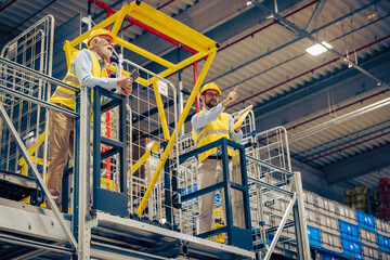 Wall Mural - Two employees are walking  at logistics center warehouse