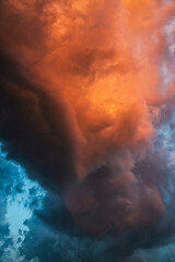 Wall Mural - Beautiful dramatic storm clouds in the sunset sky