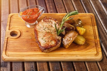 Poster - Grilled tasty meat dish on wooden board