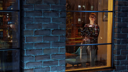 Leinwandbilder - Creative Professional Woman Working from Home in Stylish Living Room. Female Standing by the Window, Browsing Internet, Checking Social Media and Corporate Email Inbox. View Through Window.
