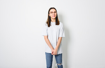 Young brunette woman on studio white background