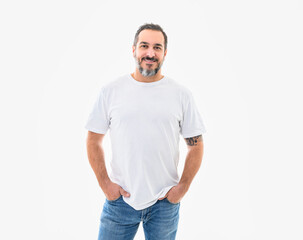 portrait of a bearded middle-aged man looking thoughtfully at the camera over a white studio background