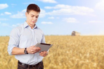 Canvas Print - Agronomist male farmer with digital tablet at field