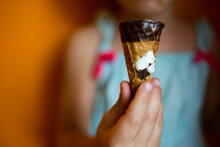 Midsection Of Girl Holding Ice Cream Cone