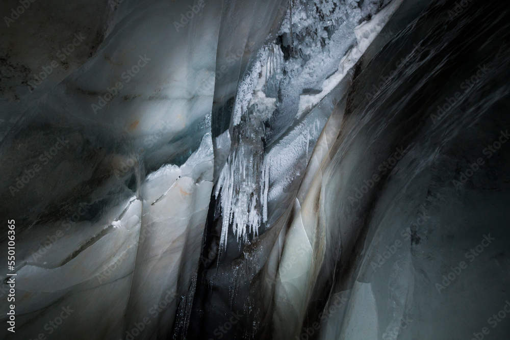 Delicate stalactites and complex strata inside an ice cave in Scott ...