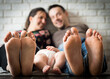 parents feet with child