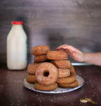 Child's Hand Reaching For Cider Donut