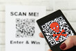 © MargJohnsonVA - QR code scam concept - scanning a fraudulent QR code can lead to phishing websites or malware apps.