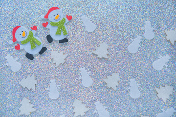 Wall Mural - Silver glitter background with white Christmas tree and two big snowman