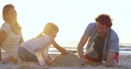 Poster - Family, beach and sand, castle and relax in summer, fun and learning, playing and bond at sunset. Happy family, building and sand castle by girl and parents in Miami for travel, vacation and holiday