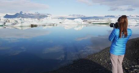 Wall Mural - iceland photographer tourist on iceland photographing nature landscape jokulsarlon glacial lagoon gl