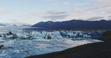 Wall Mural - jokulsarlon glacial lagoon lake in southeast iceland by vatnajokull national park. small icebergs wi