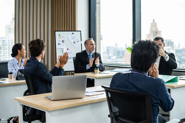 Group of multi-Ethnic businessman and businesswoman clapping together. 