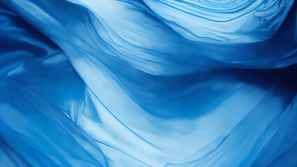 Poster - blue silk fabric in wave motion background. backdrop with copy space, graphic elements for design la