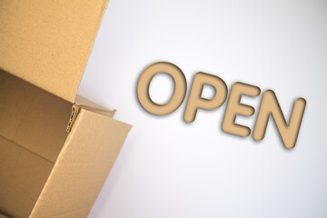 Poster - Open word with cardboard box. Brown folded card box.