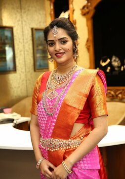 jewelry and waist chain set a young lady with wearing silk saree