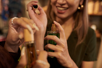 Wall Mural - Woman Spraying Perfume on Wrist