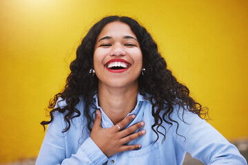 happy, smile and fun with a woman laughing and joking in studio against a yellow background. carefre