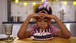 © nimito - Portrait of sad African-American-American boy sitting alone at Birthday party