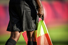 Assistant Referee Moving Along The Sideline During A Soccer Match