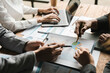 © Natee Meepian - Startup business meeting to analyze and discuss the situation on the financial report in the meeting room. Investment Consultant, Financial advisor and accounting concept.