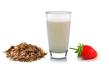 Glass Of Milk ,strawberry And Muesli On White Background