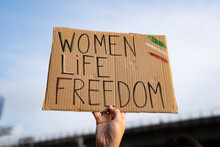 Demonstrator Holding "Women, Life, Freedom" Placard